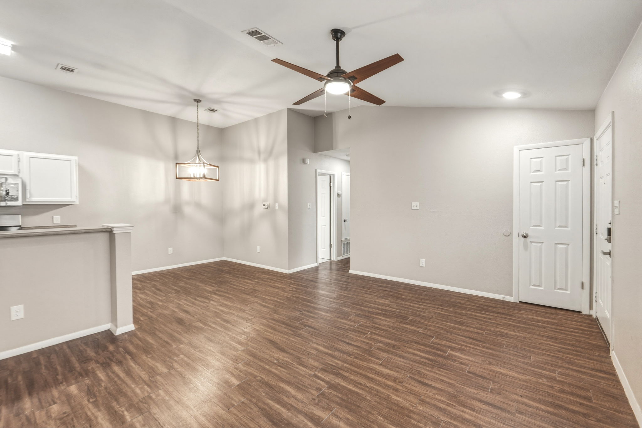 2302 Fuzz Fairway, Unit A Austin, TX 78728 - Photo 12 of 32 a view of empty room with wooden floor and ceiling fan