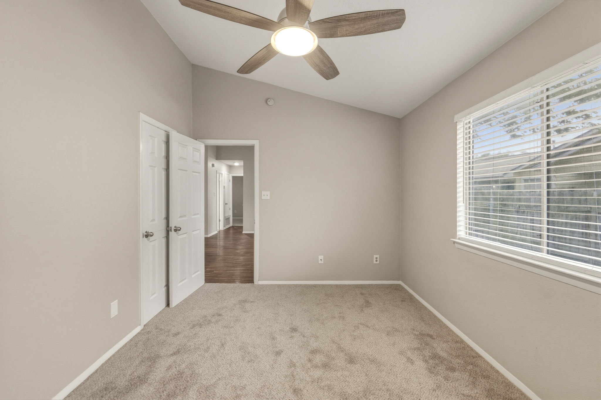 2302 Fuzz Fairway, Unit A Austin, TX 78728 - Photo 15 of 32 a view of empty room with window and a ceiling fan