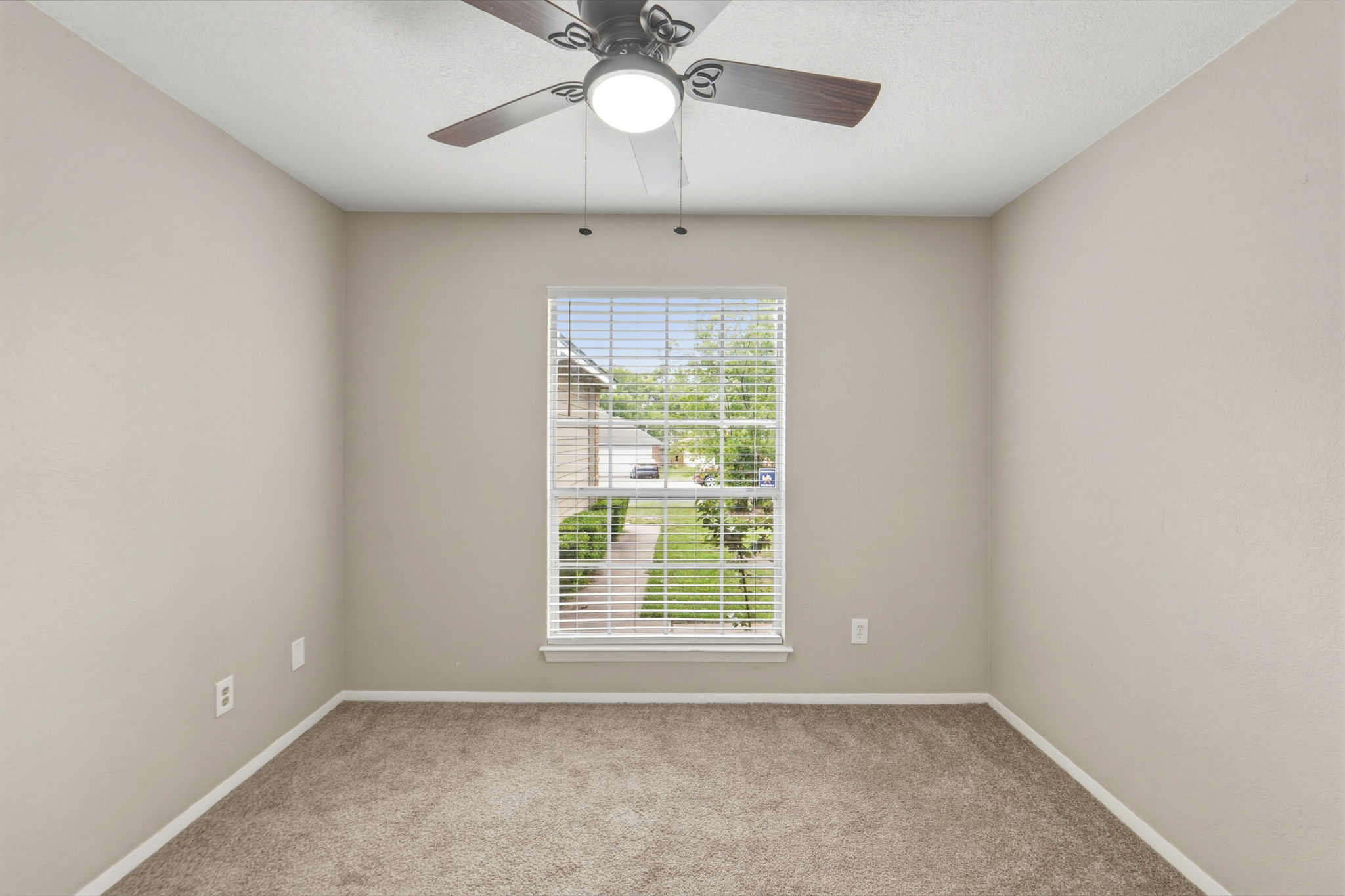 2302 Fuzz Fairway, Unit A Austin, TX 78728 - Photo 17 of 32 an empty room with a window and a fan