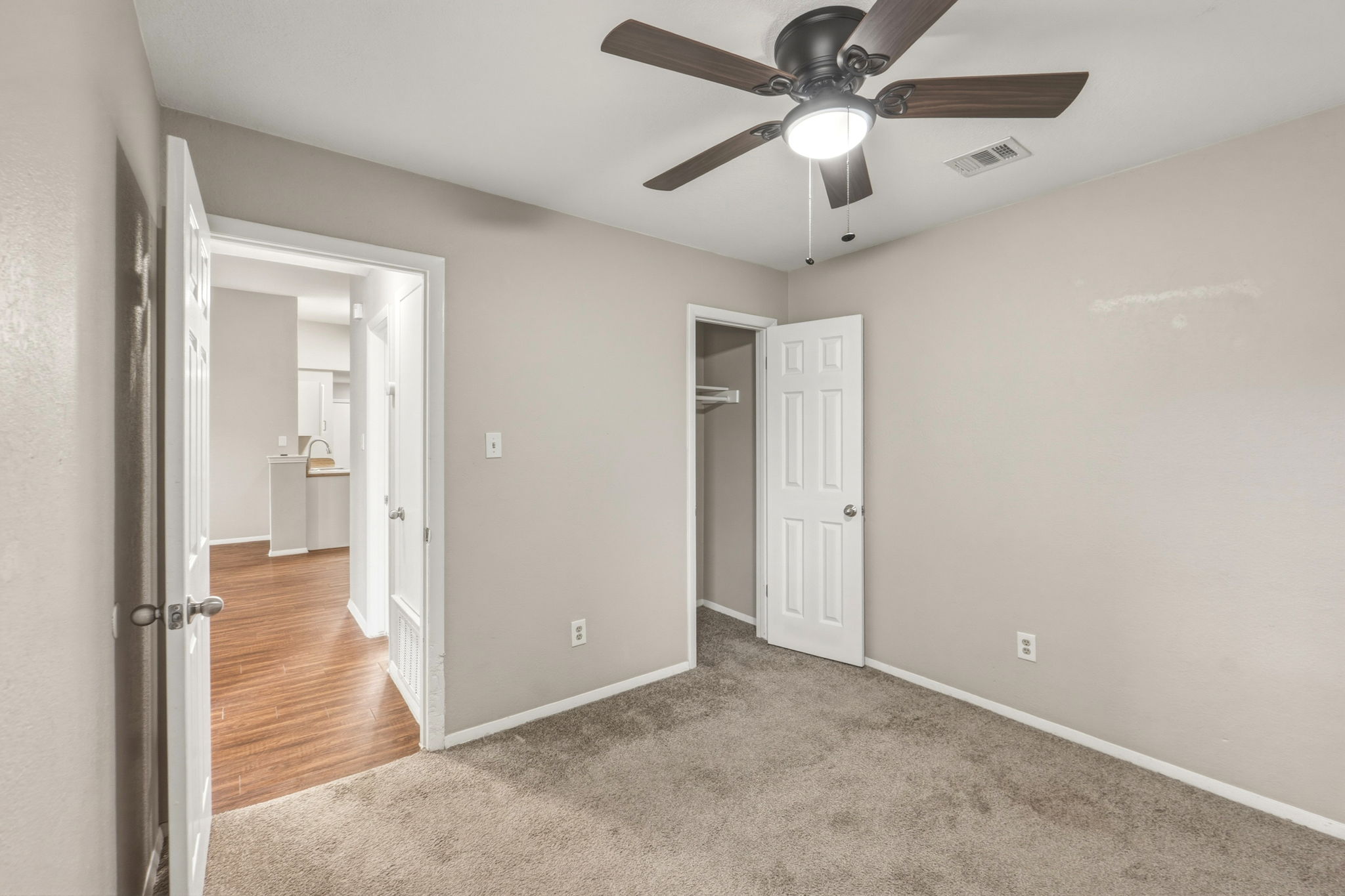 2302 Fuzz Fairway, Unit A Austin, TX 78728 - Photo 20 of 32 an empty room with fan and entrance