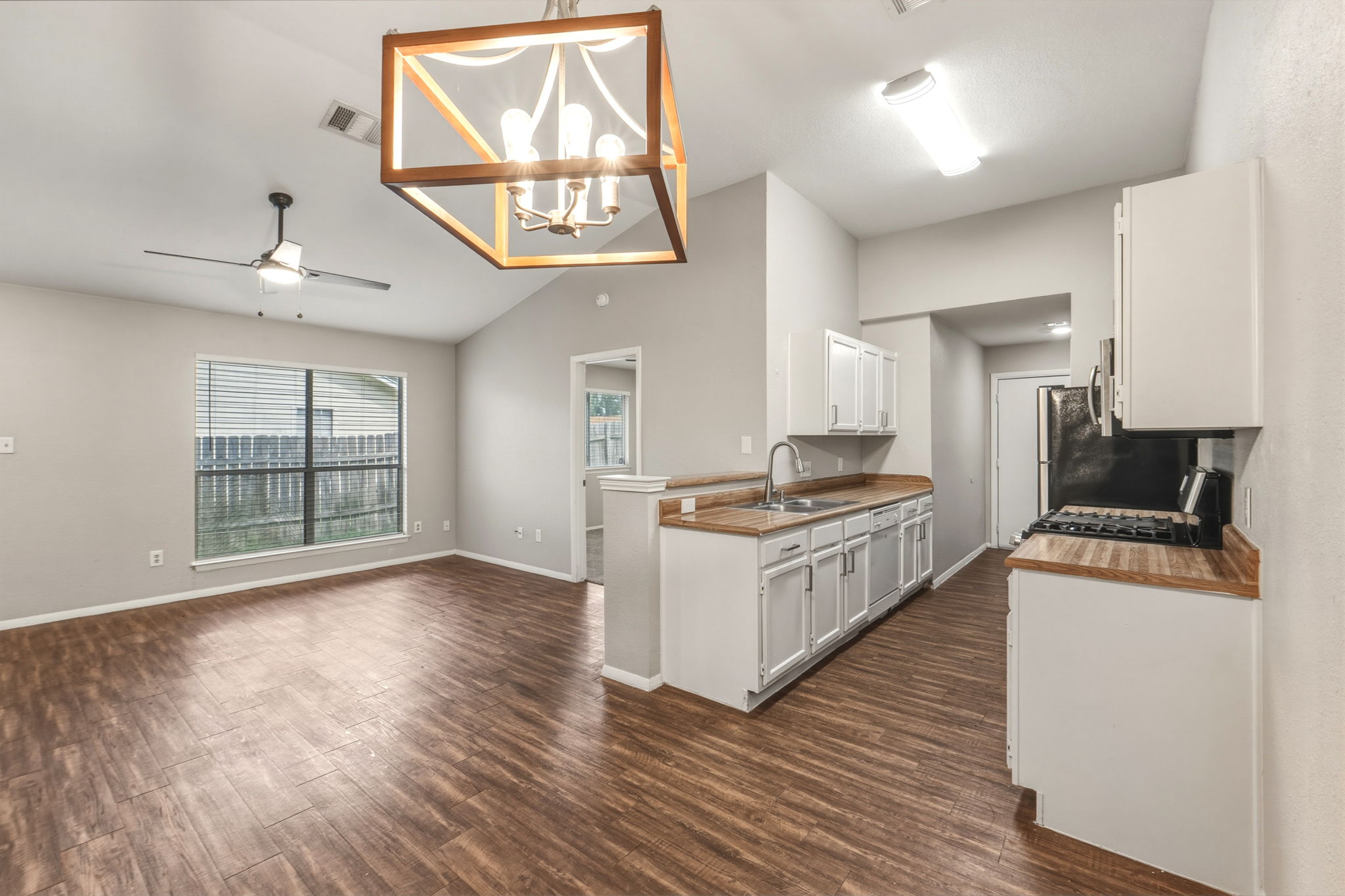 2302 Fuzz Fairway, Unit A Austin, TX 78728 - Photo 2 of 32 a kitchen with stainless steel appliances granite countertop a stove and a sink