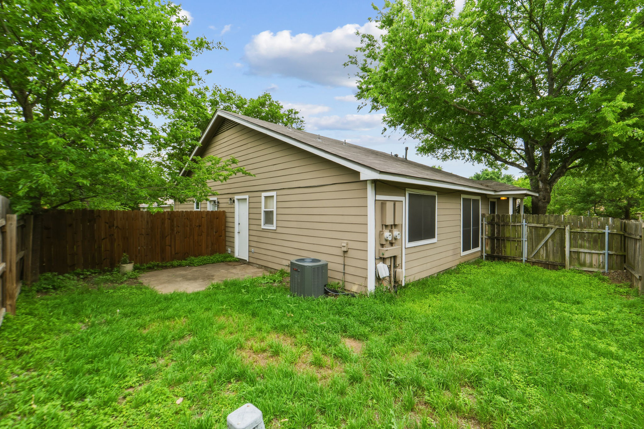 2302 Fuzz Fairway, Unit A Austin, TX 78728 - Photo 28 of 32 a view of a house with a yard and sitting area