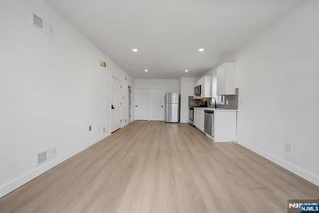 a view of kitchen with wooden floor