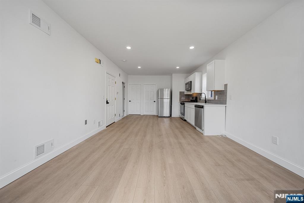 61 Farnham Avenue, Unit 1 Garfield, NJ 07026 - Photo 8 of 14 a view of kitchen with wooden floor