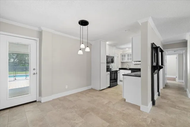 a view of a kitchen with appliances