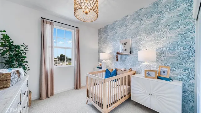 a bedroom with furniture and a baby crib