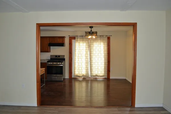 a stove top oven sitting inside of a kitchen