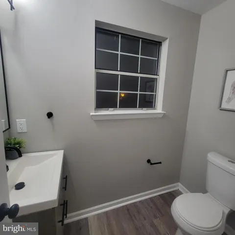 a bathroom with a toilet and a sink