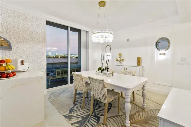 a spacious bedroom with a bed and a flat screen tv