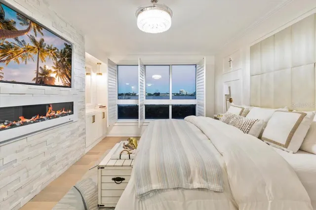 a living room with furniture and floor to ceiling windows