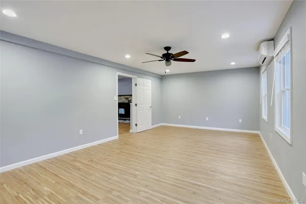 a view of an empty room with a window