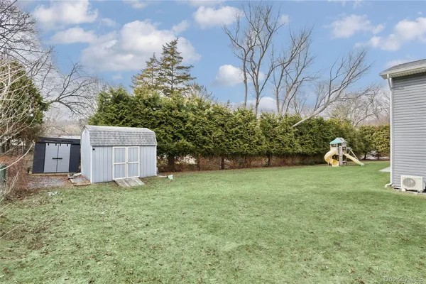a backyard of a house with lots of green space