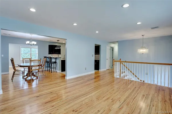 a view of kitchen with furniture and wooden floor
