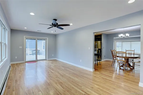 a view of a livingroom with furniture and wooden floor