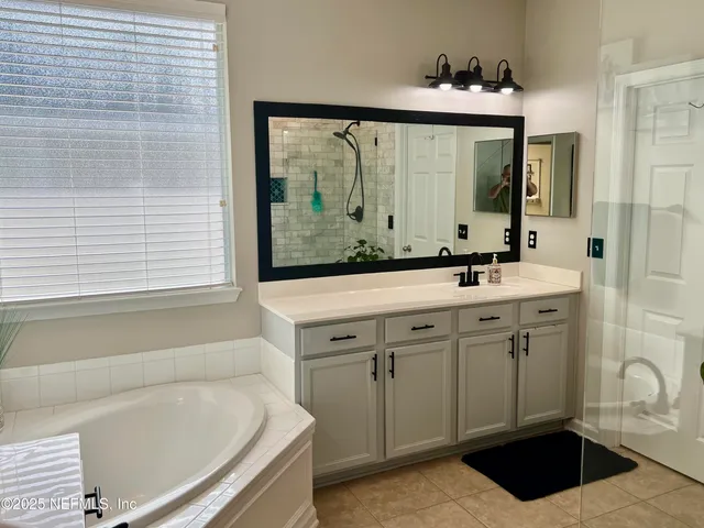 a bathroom with a sink and a bathtub