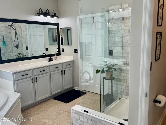 a bathroom with a double vanity sink and mirror