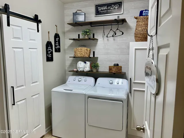 a utility room with dryer and washer