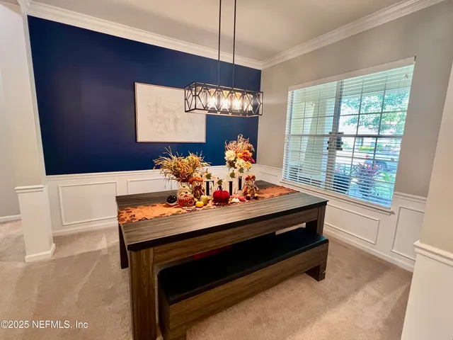 a room with furniture and a chandelier
