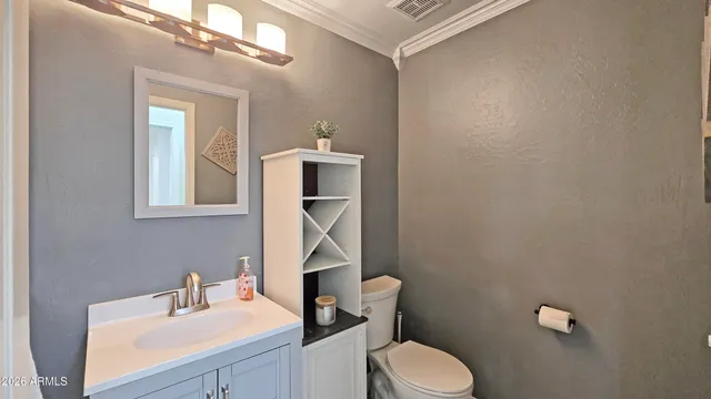 a utility room with sink dryer and washer
