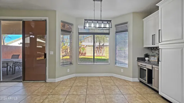 a kitchen with stainless steel appliances granite countertop a refrigerator sink and stove