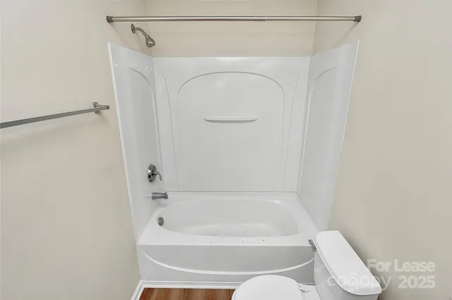 a bathroom with a bath tub and a shower