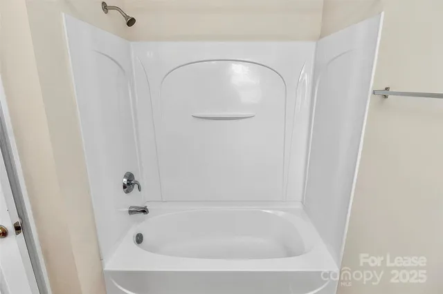a close view of a bathtub in bathroom