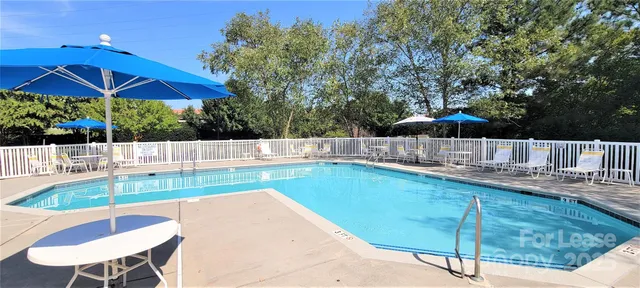 a view of a backyard with sitting area