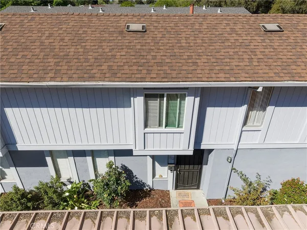 a aerial view of a house with wooden deck