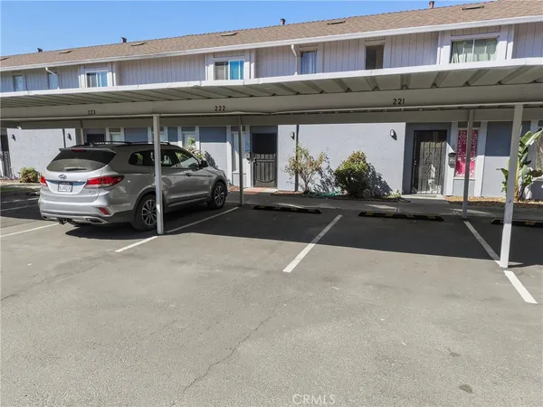 a view of a car park in front of a building