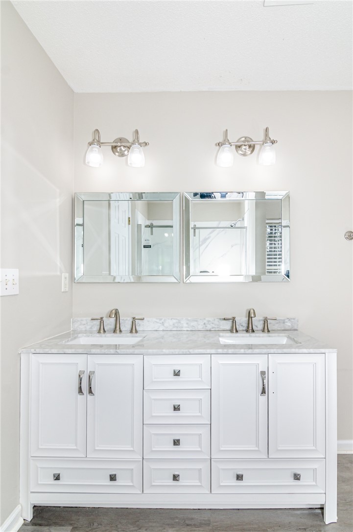 102 Hawk Ridge Drive Anderson, SC 29621 - Photo 13 of 38 This primary bathroom features a double vanity with ample storage and elegant fixtures.