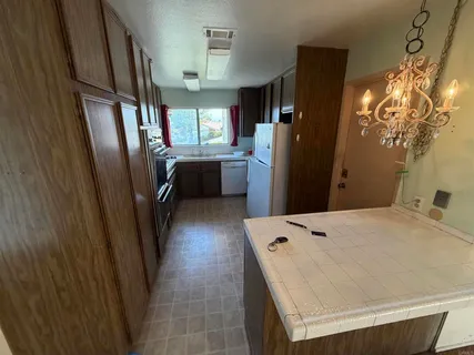 a bedroom with a bed dresser and a window