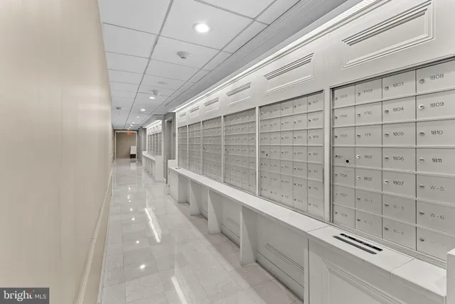 a room with lots of counter space and wooden floor