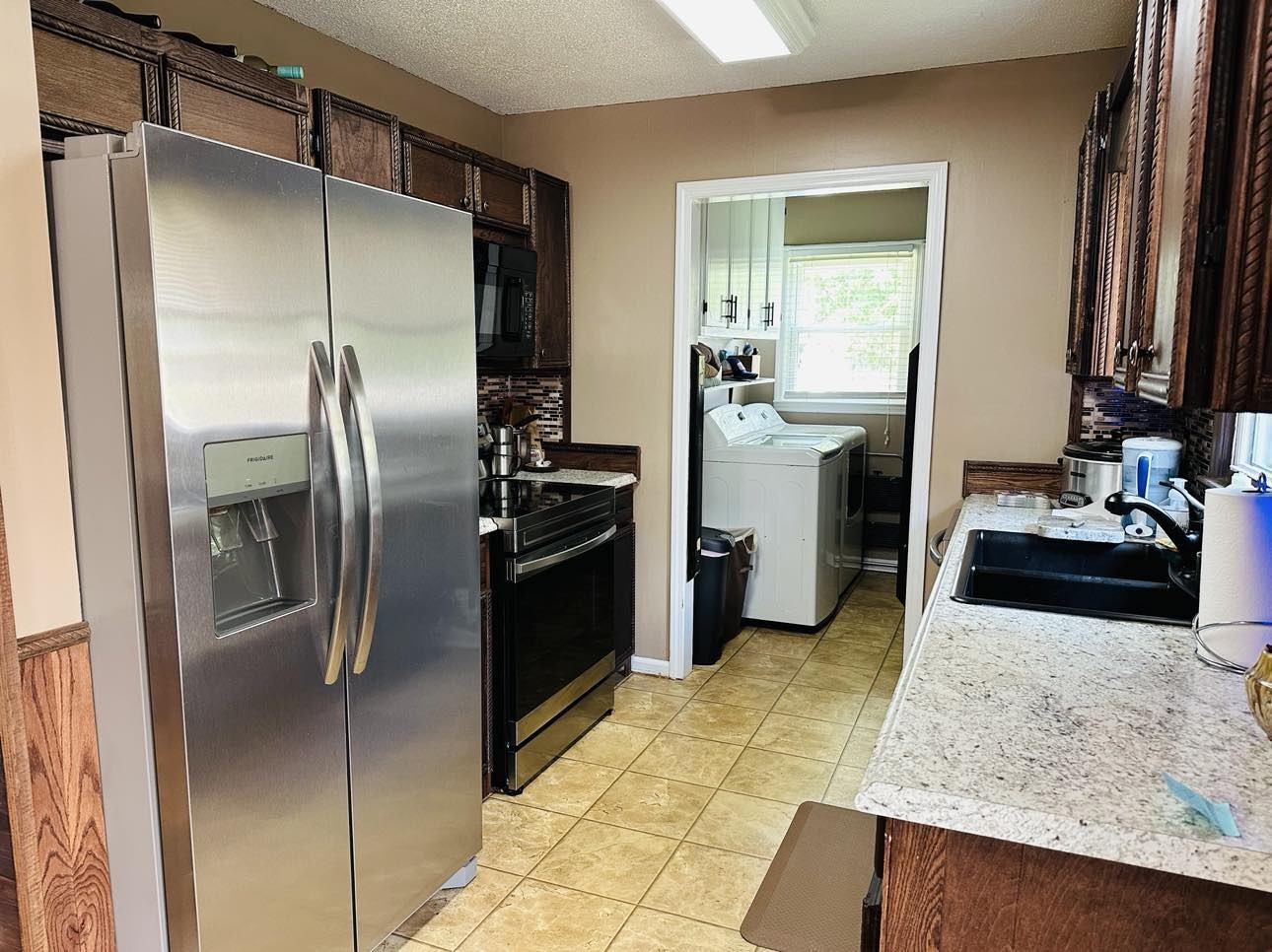 1753 Vales Mill Road Pulaski, TN 38478 - Photo 7 of 14 a kitchen with a refrigerator sink and stove