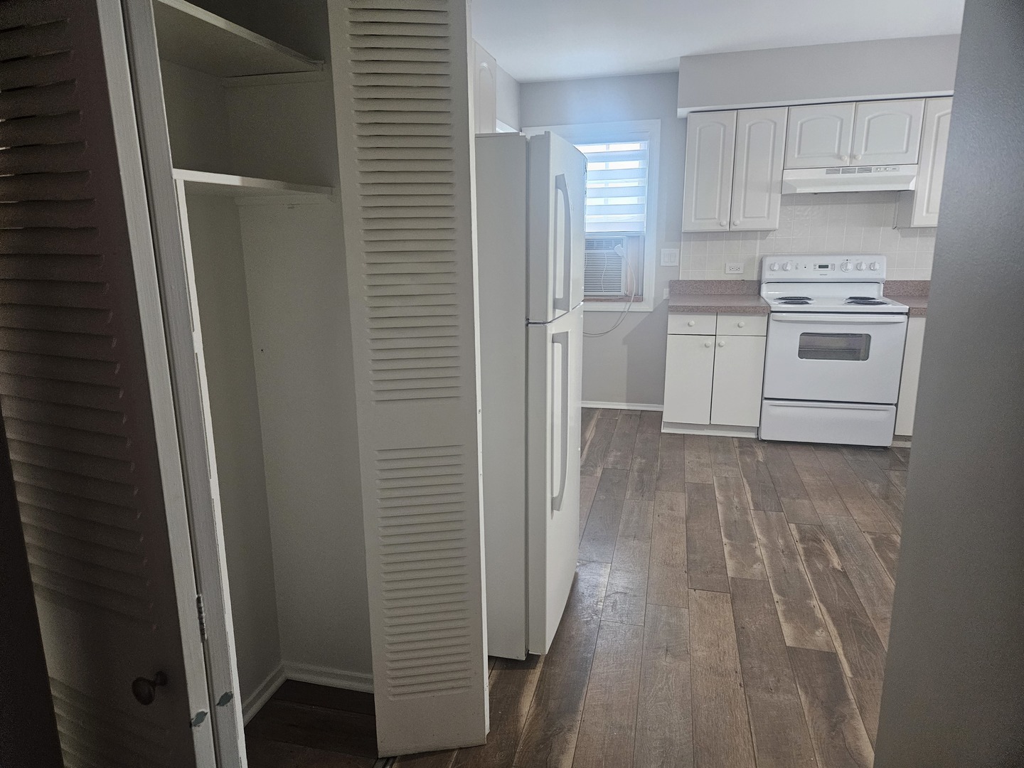 863 North Northwest Highway Park Ridge, IL 60068 - Photo 19 of 31 a view of a kitchen with white cabinets and wooden floor
