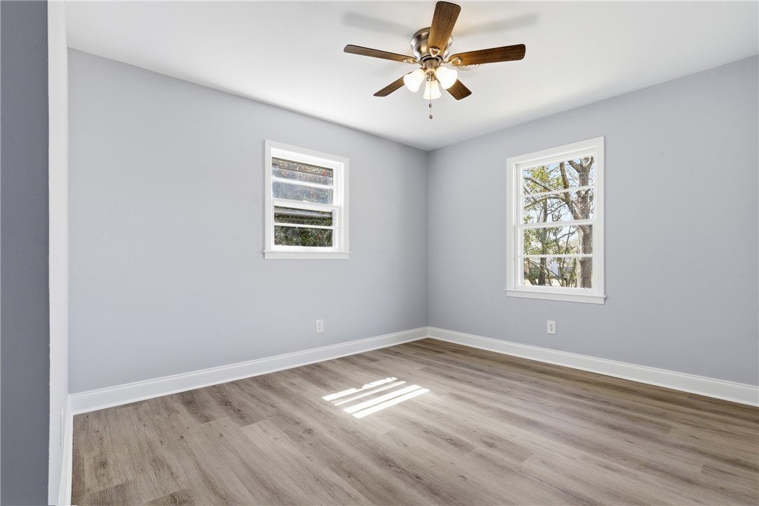 410 Springdale Avenue Liberty, SC 29657 - Photo 17 of 50 This airy room features durable flooring and ample natural light, perfect for any use.