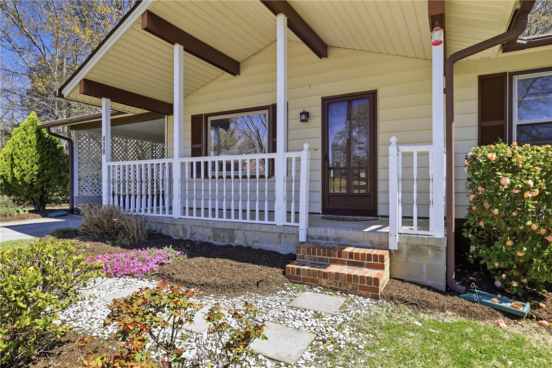 410 Springdale Avenue Liberty, SC 29657 - Photo 2 of 50 The welcoming porch and lush landscaping create an inviting entrance to this charming residence.