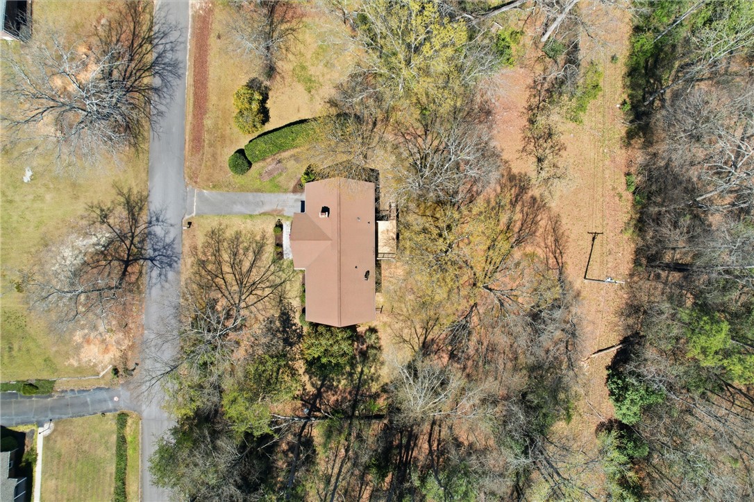 410 Springdale Avenue Liberty, SC 29657 - Photo 28 of 50 An aerial perspective reveals a private residence nestled among lush greenery and natural surroundings.