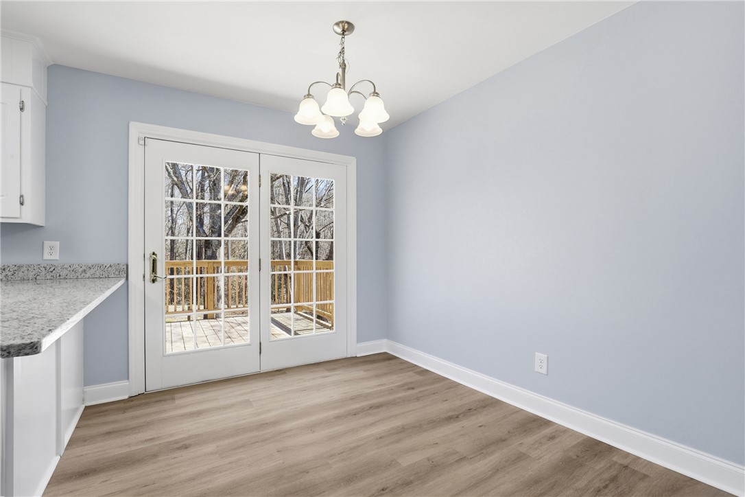 410 Springdale Avenue Liberty, SC 29657 - Photo 6 of 50 This bright space features sleek flooring and convenient outdoor access, perfect for daily living.