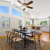 a view of a dining room with furniture and window