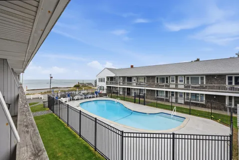 a view of a swimming pool with a deck