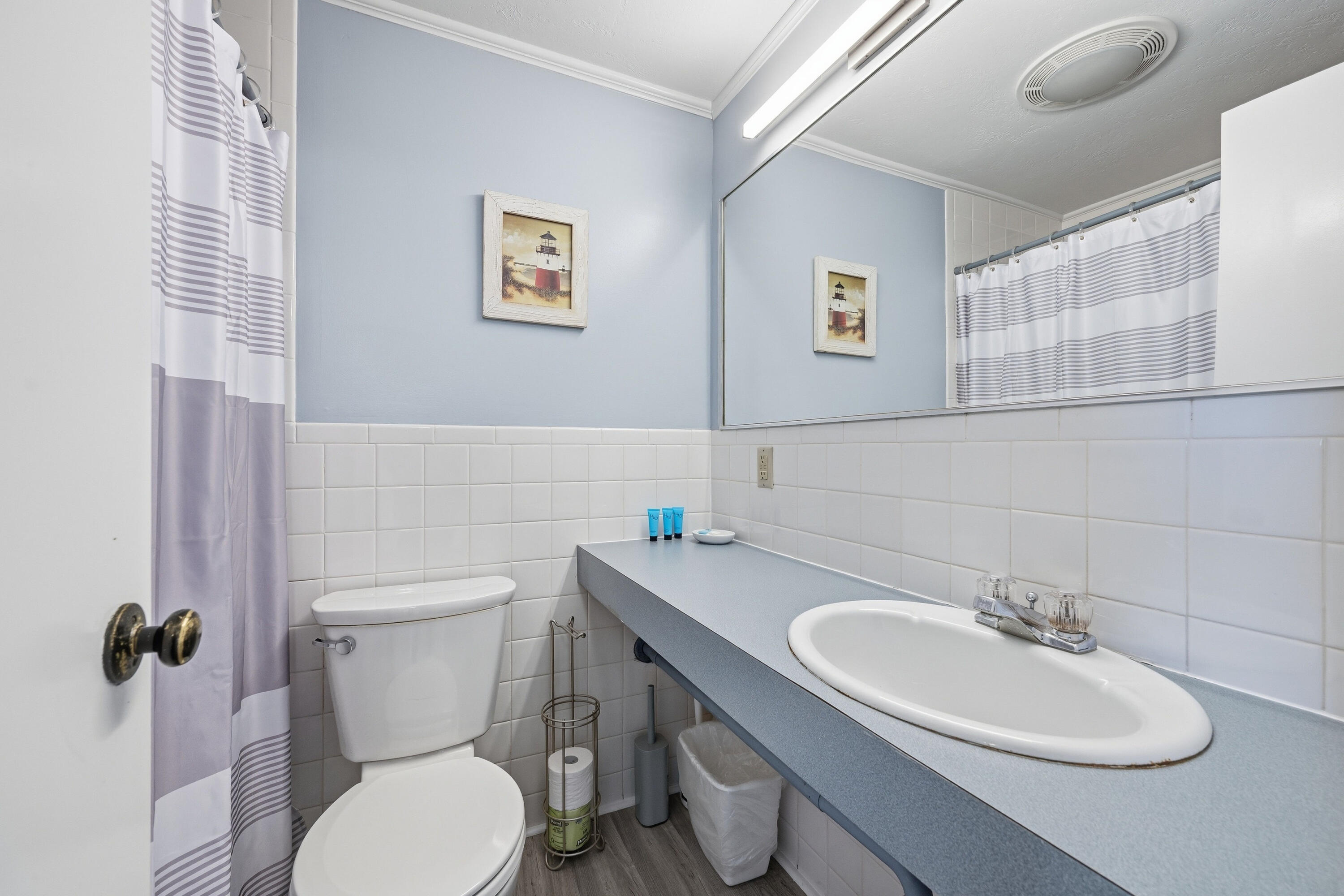 154 Old Wharf Road, Unit 51 Dennis Port, MA 02639 - Photo 12 of 12 a bathroom with a sink mirror and toilet