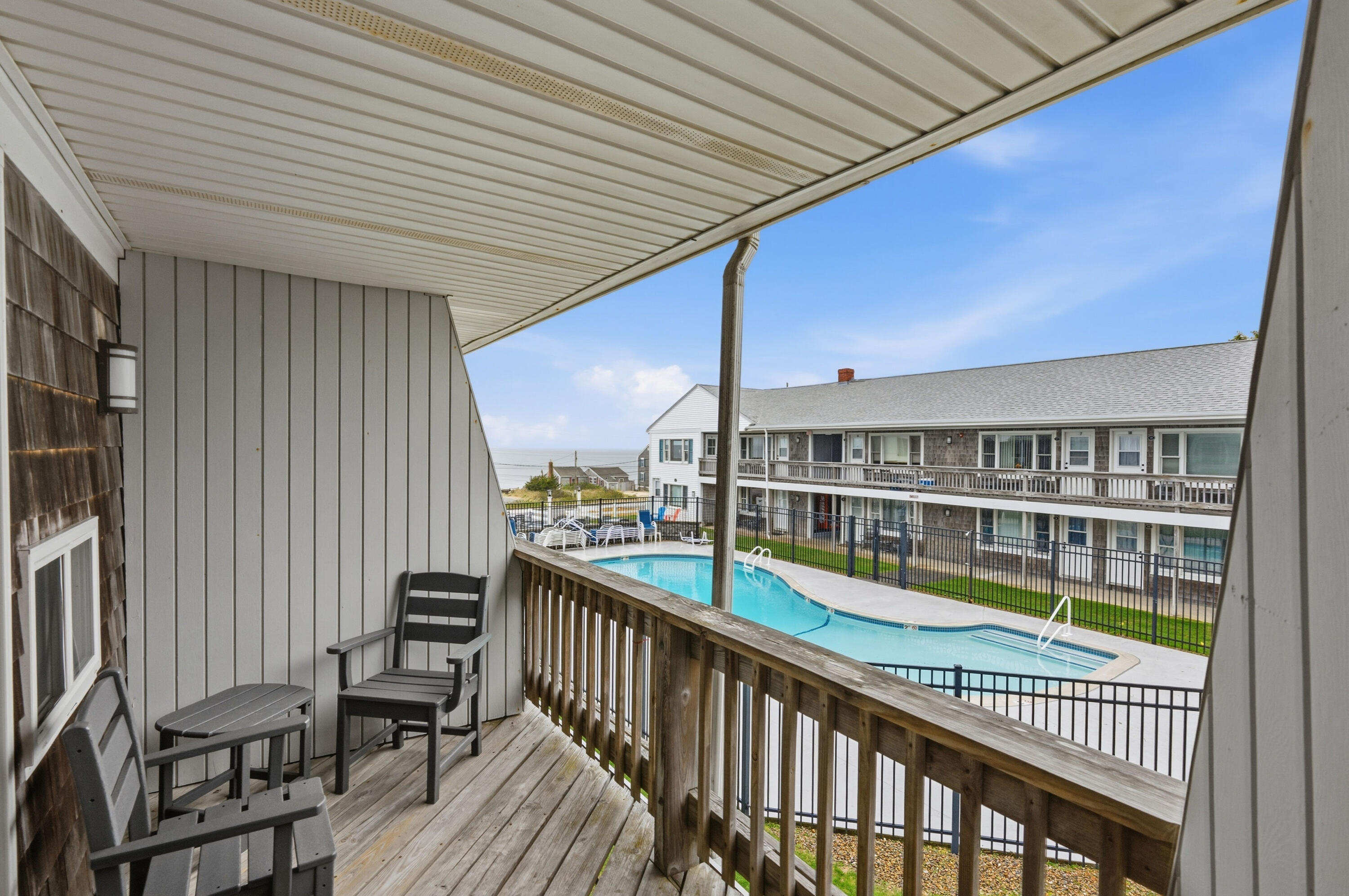 154 Old Wharf Road, Unit 51 Dennis Port, MA 02639 - Photo 2 of 12 a view of a balcony with chairs