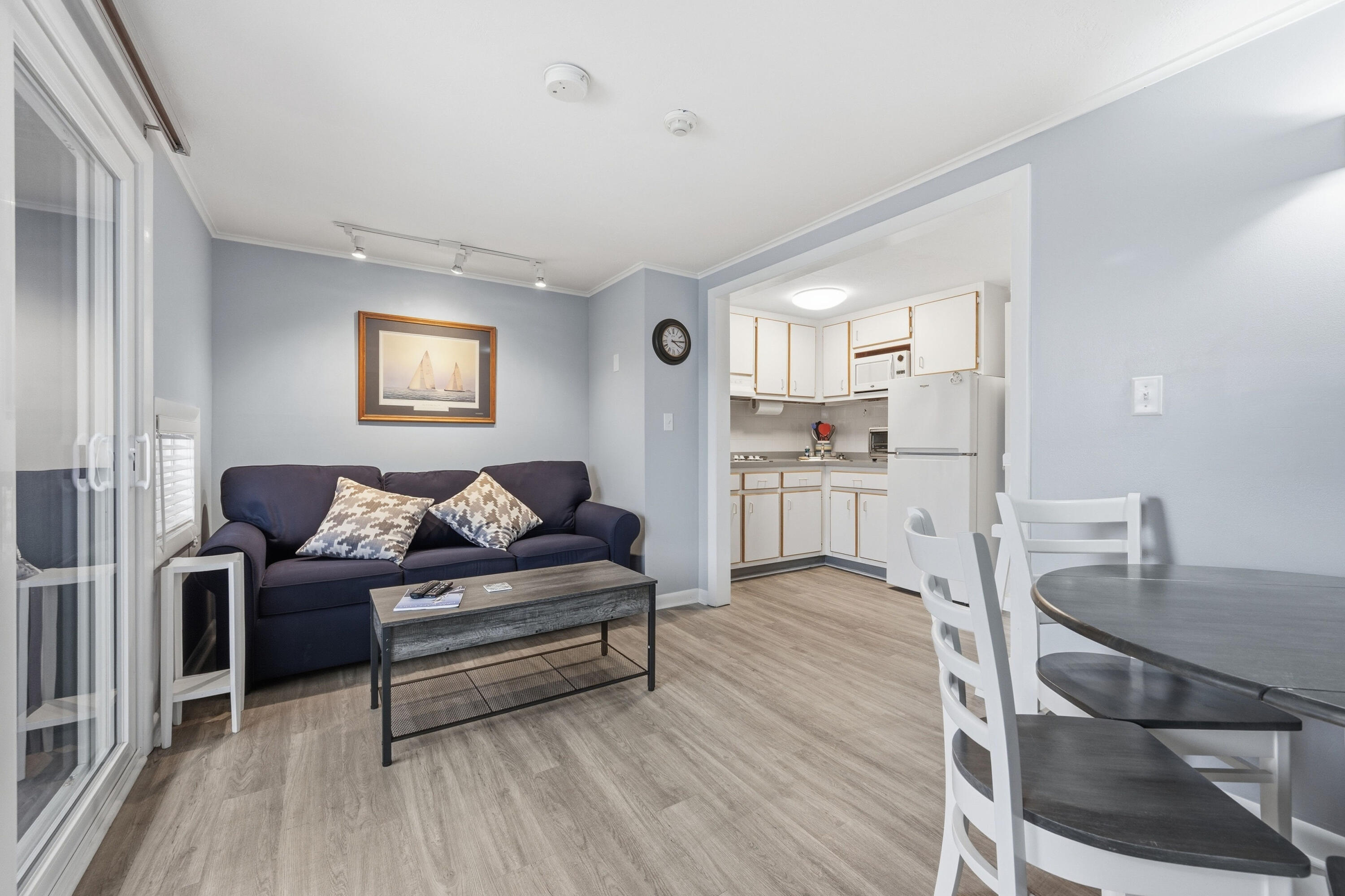 154 Old Wharf Road, Unit 51 Dennis Port, MA 02639 - Photo 6 of 12 a living room with furniture and a wooden floor