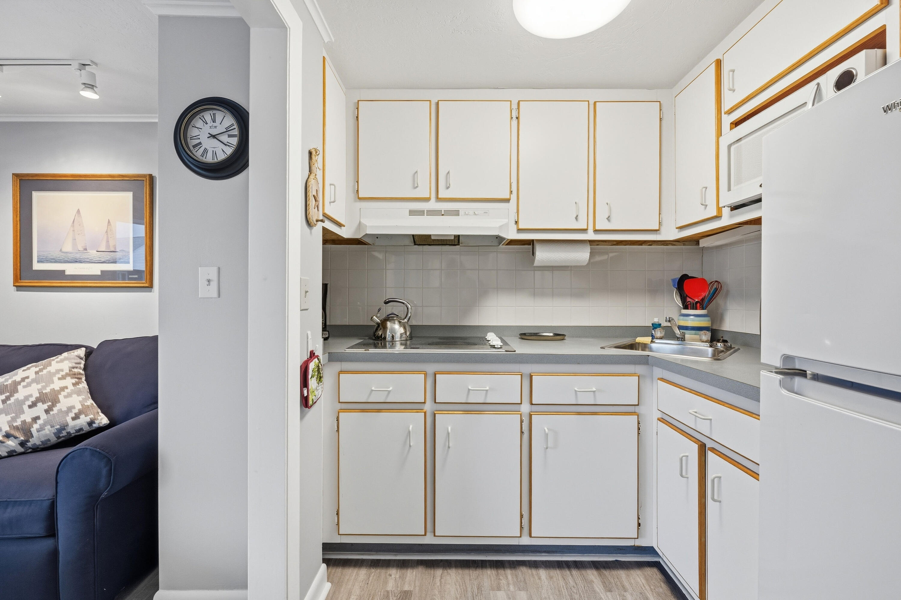 154 Old Wharf Road, Unit 51 Dennis Port, MA 02639 - Photo 10 of 12 a kitchen with stainless steel appliances granite countertop a sink and a stove
