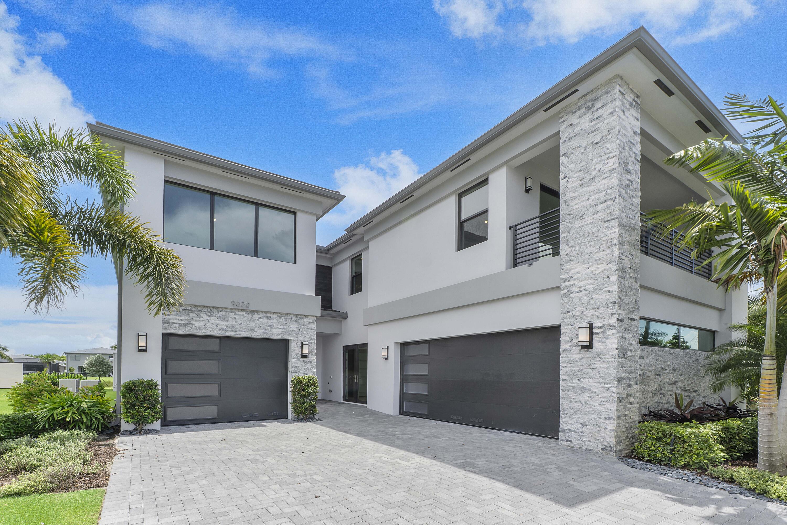 9322 Sunflower Mdw Road Boca Raton, FL 33434 - Photo 3 of 87 a front view of a house with yard