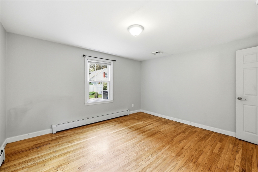 130 Connecticut Avenue Springfield, MA 01107 - Photo 31 of 40 wooden floor in an empty room with a window