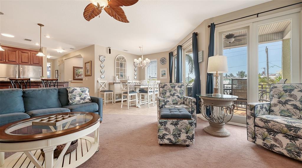 220 36th Street Holmes Beach, FL 34217 - Photo 12 of 59 a living room with furniture and a large window