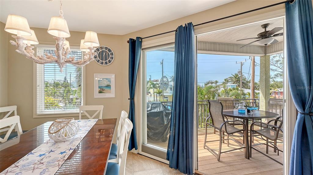 220 36th Street Holmes Beach, FL 34217 - Photo 14 of 59 a very nice looking room with a large window and dining area