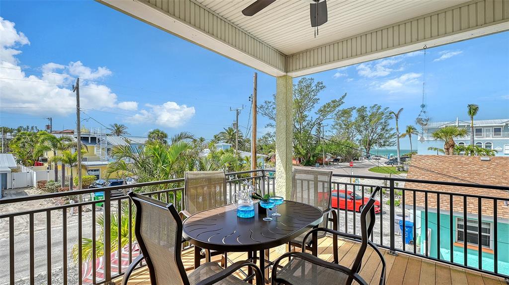 220 36th Street Holmes Beach, FL 34217 - Photo 15 of 59 a view of a balcony with furniture