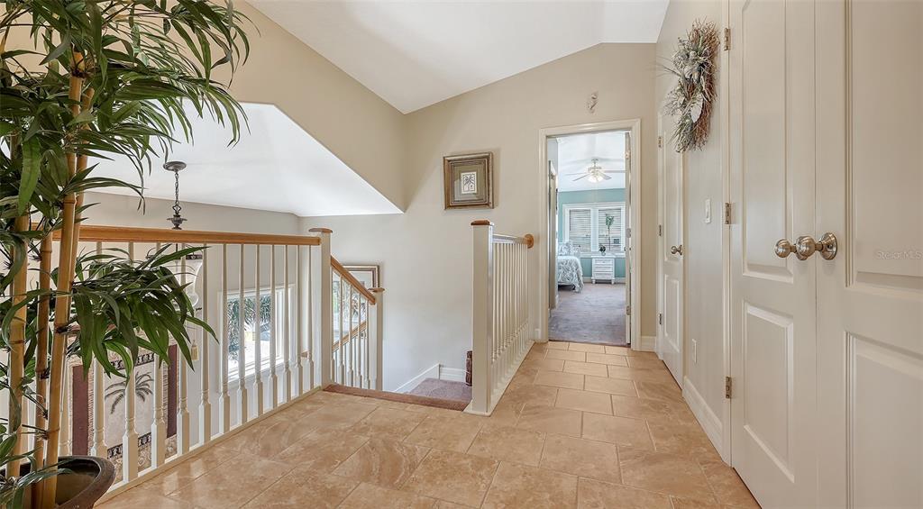 220 36th Street Holmes Beach, FL 34217 - Photo 24 of 59 a view of a hallway with potted plants